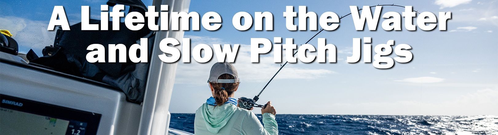 Person standing on a fishing boat using a bent fishing rod to battle a fish over open ocean water, illustrating slow pitch jigging offshore.