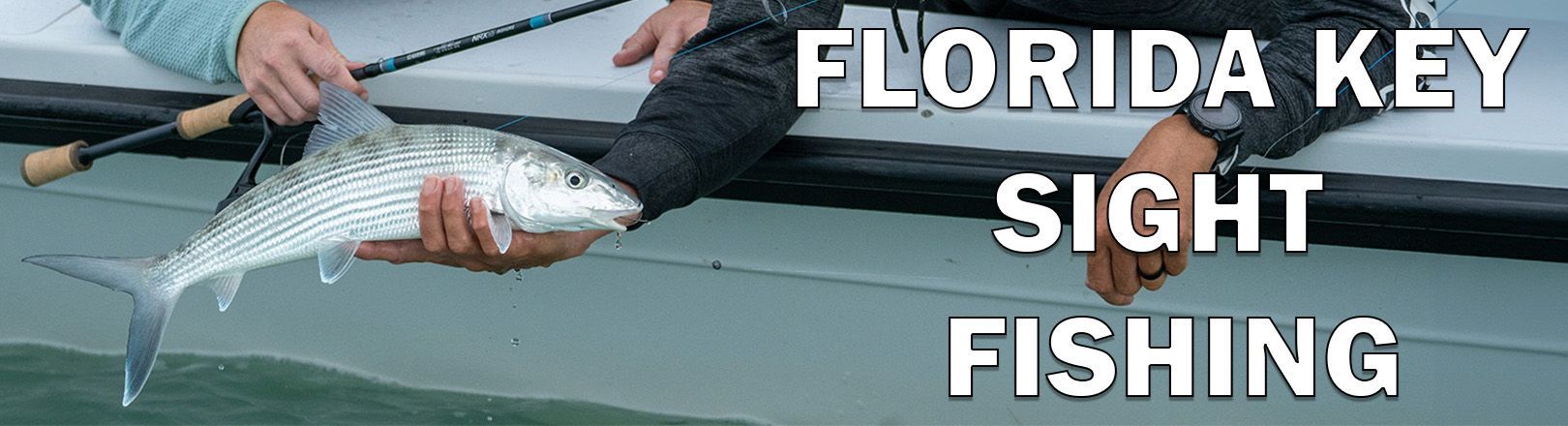 Angler holding a silver-colored fish beside a boat with text "FLORIDA KEY SIGHT FISHING" in white text outlined in black.
