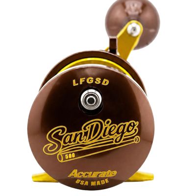 Accurate Tern2 TXD-500X San Diego Limited Edition Reel with a brown and gold conventional fishing reel, featuring San Diego 500 graphics on the side plate and a power handle knob.