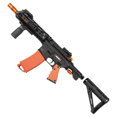 Byrna Mission 4 Launcher in black and orange shown from the left side with a stock, textured grip, and detachable magazine against a plain background.