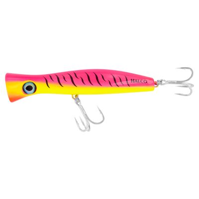 Halco Roosta Popper Haymaker KO Lure - R1: Pink Fluoro, a popper fishing lure with a bright pink upper body, fluorescent yellow lower body, orange face, black stripe markings, large blue eye, two silver-colored treble hooks, and visible text "HALCO" in bl