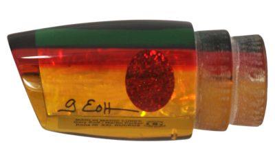 Marlin Magic XXL Ruckus - #11 - Rasta color trolling lure with orange-yellow tint and red stripes, angled-face, shell insert, and a red eye.
