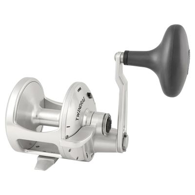 Accurate Valiant 2 VT-600-S Single Speed Lever Drag Conventional Reel with silver-colored frame, spool, reel foot, handle arm and black oval shaped handle. "TWINDRAG" and "STRIKE" on side.