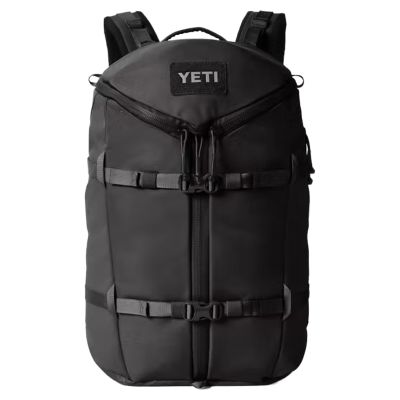 Yeti Ranchero Commuter Backpack - 27L - Black, black backpack with a front zippered opening, compression straps, top carry handle, and text "YETI" on the front patch.