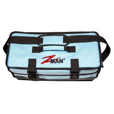 Z-Man ElaZtech Bait BlockZ light blue soft-sided tackle storage bag with black trim, shoulder strap, top handle, and front buckle closures.
