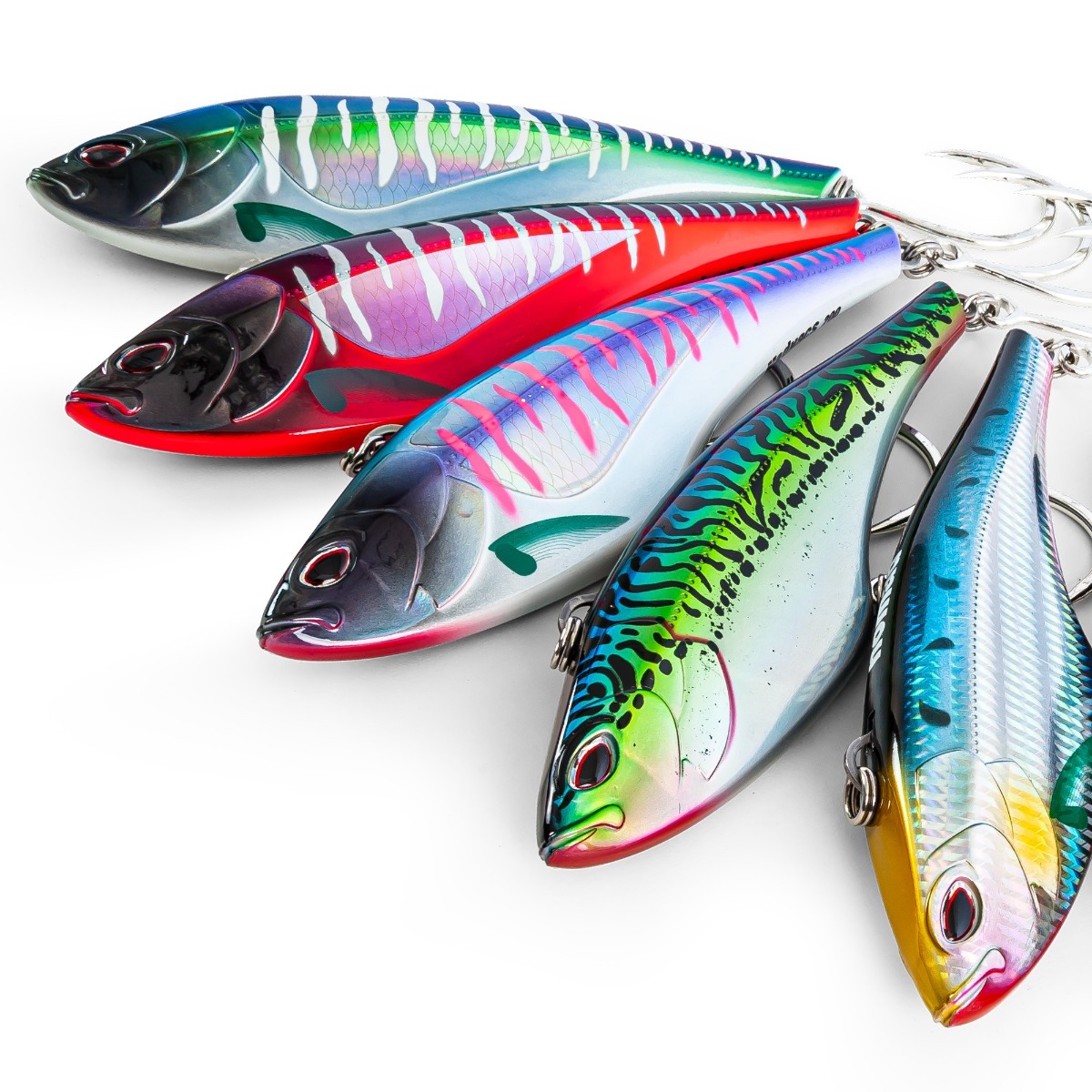 Nomad Design Madmacs Trolling Baits. 5 of these colorful fish-shaped trolling lures with glossy finishes and single hooks, each with unique scale and fish patterns in shades of green, red, blue, yellow, and purple, arranged in a fan layout.