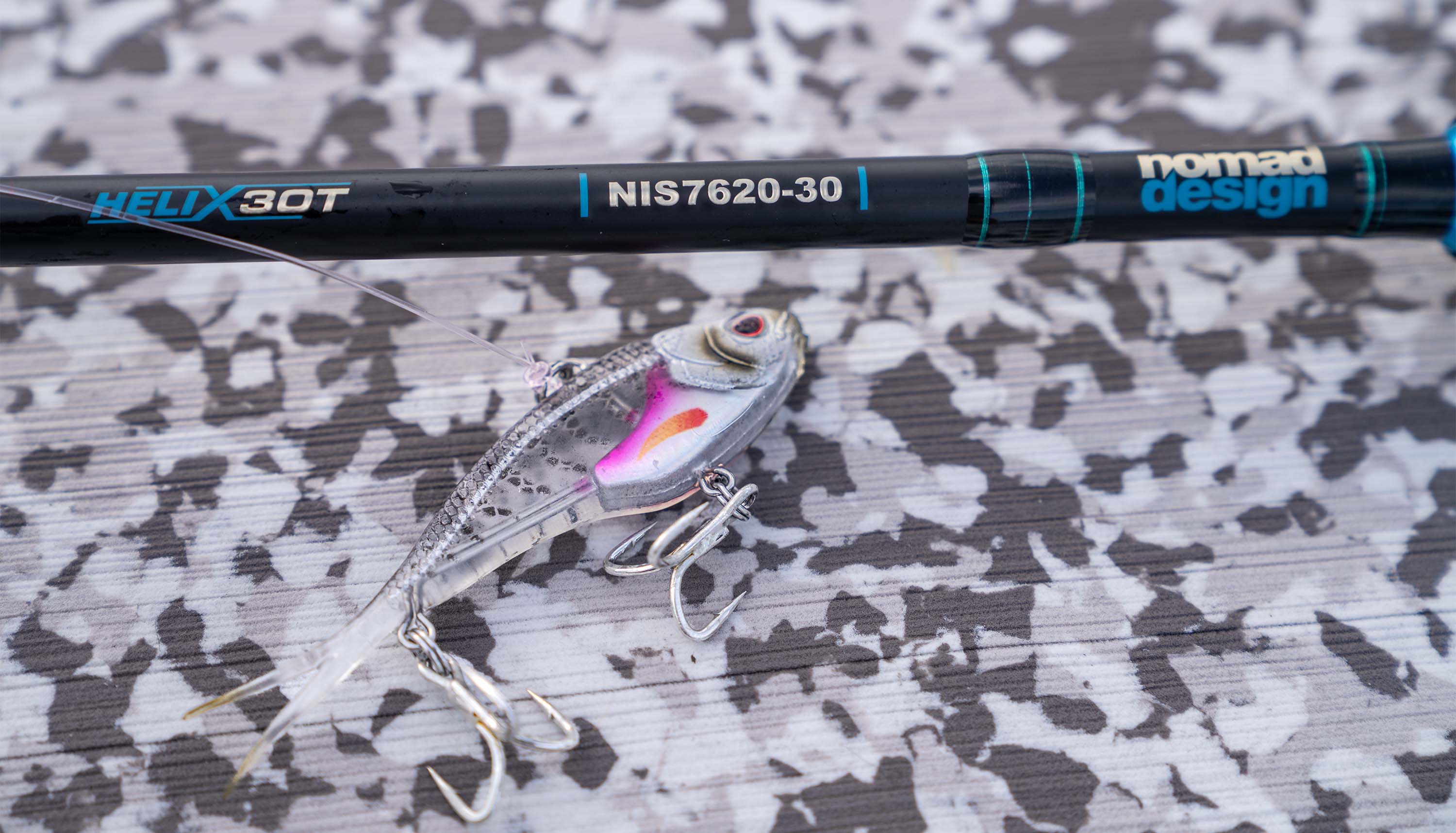 How to Vibe for Snook: The Gear, Technique, and Tackle I Trust image featuring a Nomad Design HELIX 30T rod with a fishing lure.